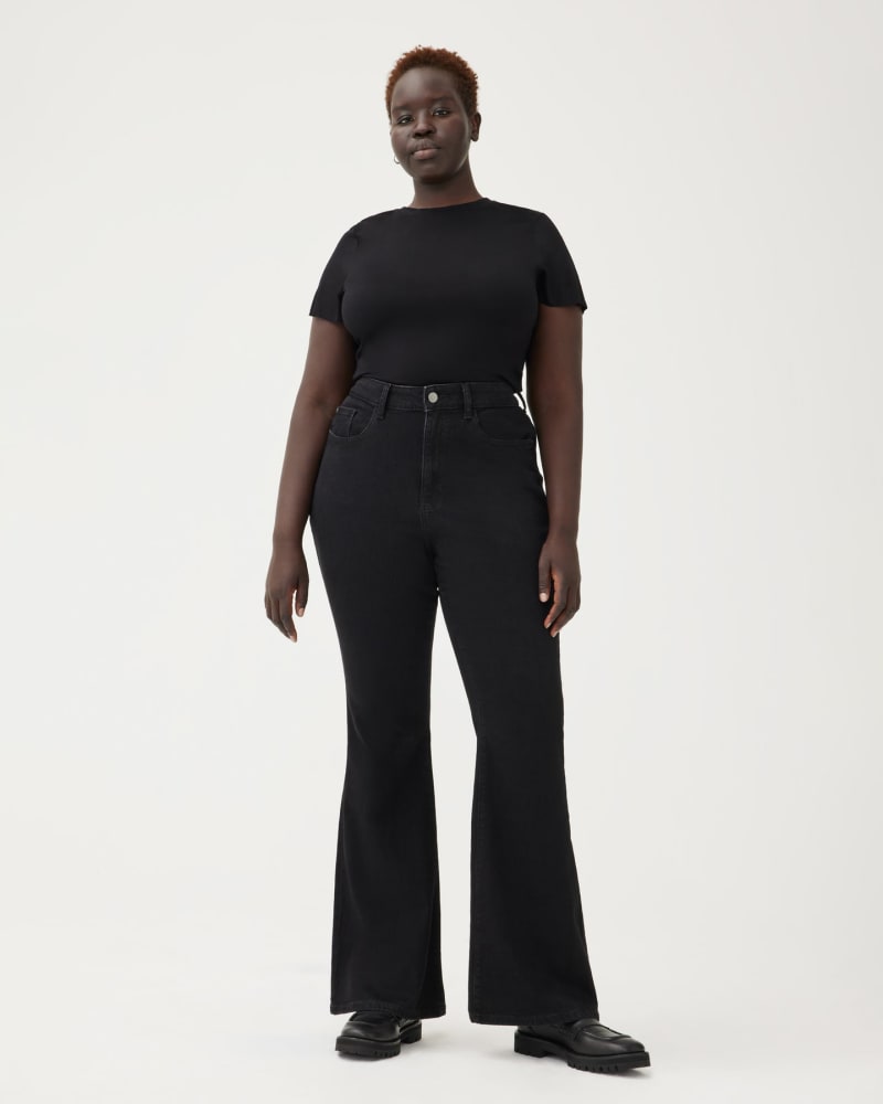 Front of a model wearing a size 18X33 MIA PLUS - HIGH RISE FLARE | WELL in WELL by Warp + Weft. | dia_product_style_image_id:292998